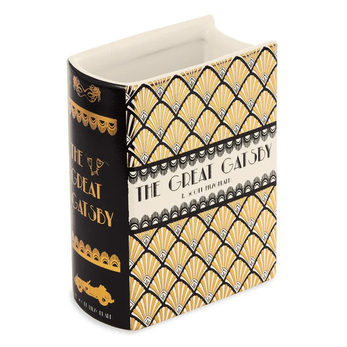 A rectangular vase shaped as a book featuring the Great Gatsby cover.
