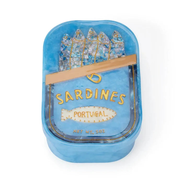Blue sardine can-shaped jewelry box with decorative lid on a white background