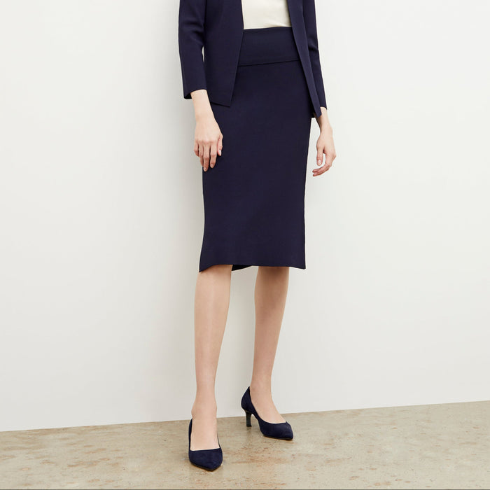 Front image of a woman wearing the harlem skirt in navy | Lead