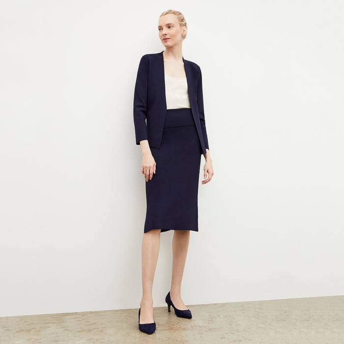 Front image of a woman wearing the harlem skirt in navy