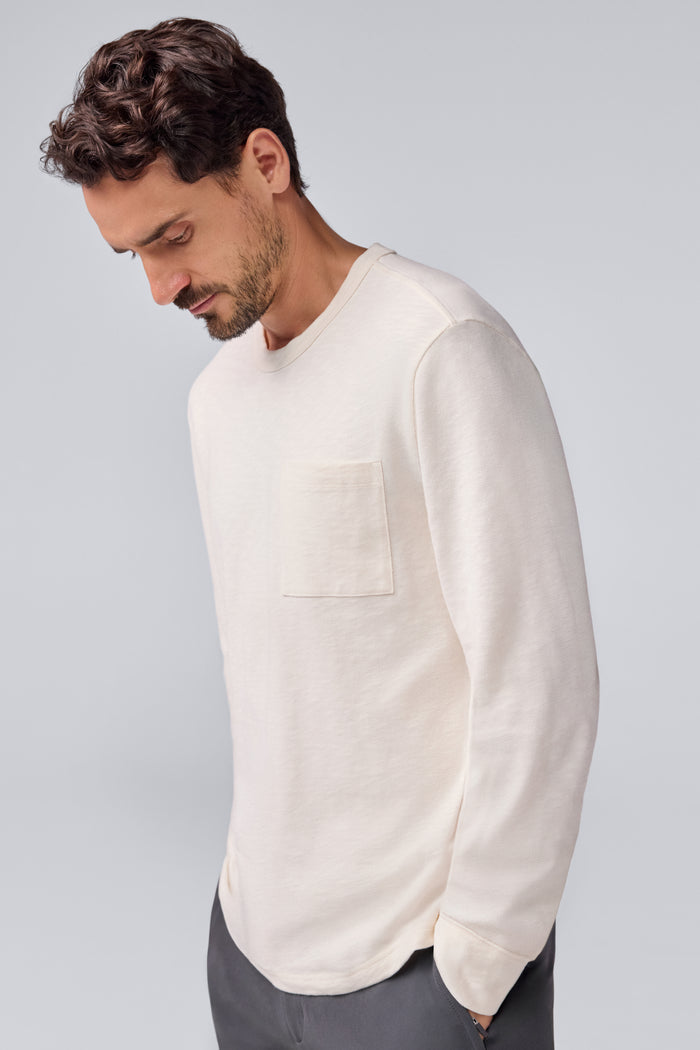 Side view of a man wearing Heavyweight Relaxed Long Sleeve T-Shirt in Froth