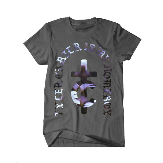 A dark gray Tyler Carter t-shirt displays a large central cross and crescent graphic with the text “TYLER, CREATOR IS MY HOMEBOY” in bold, curved letters around it.