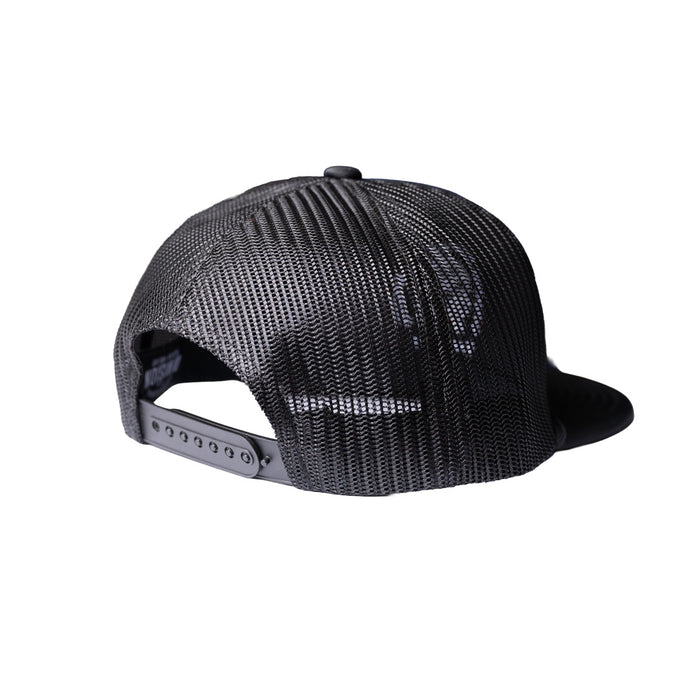 Black trucker-style snapback cap shown from the back, featuring a textured mesh back and a flat brim, on a solid white background.