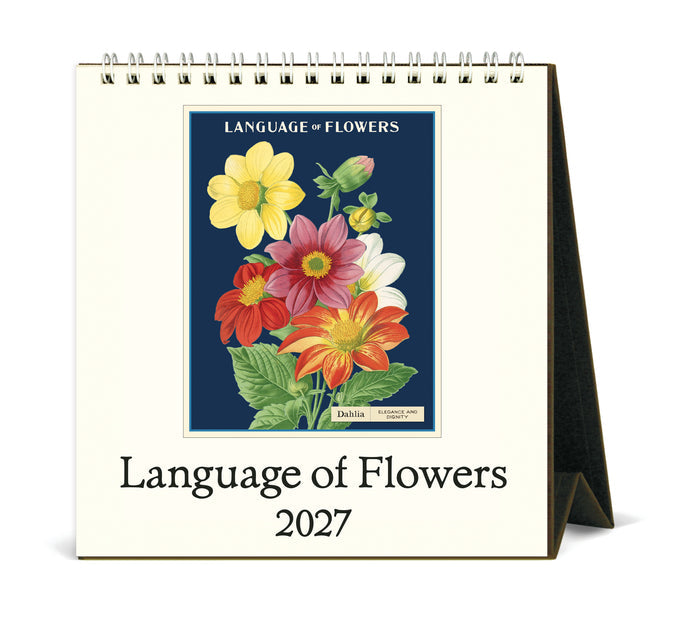 A spiral-bound 2027 desk calendar titled 'Language of Flowers' with a vintage floral illustration on the front cover, shown standing on a white background.
