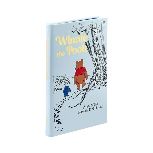 Book cover of 'Winnie the Pooh' with illustrations of Pooh and Piglet walking.