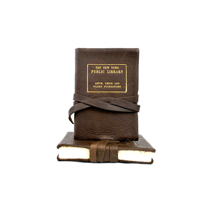 Leather journal with The New York Public Library gold stamp, tied with string.