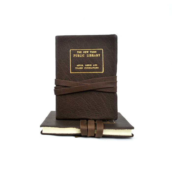 Leather journal with The New York Public Library gold stamp, tied with string.