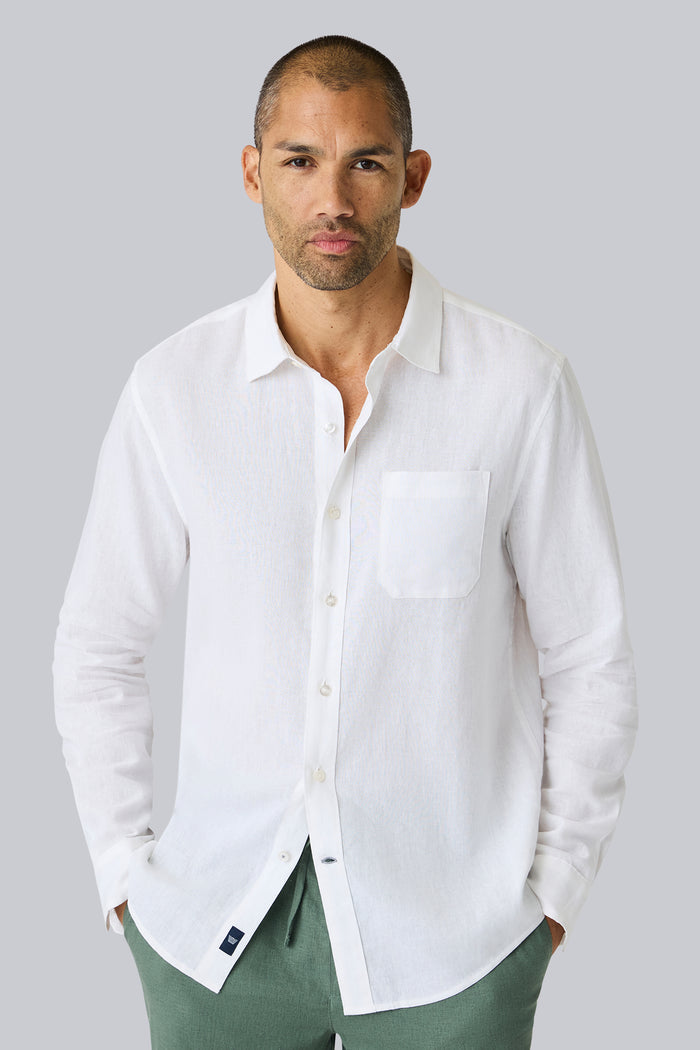 Front view of a man wearing Linen Button Up in Bright White