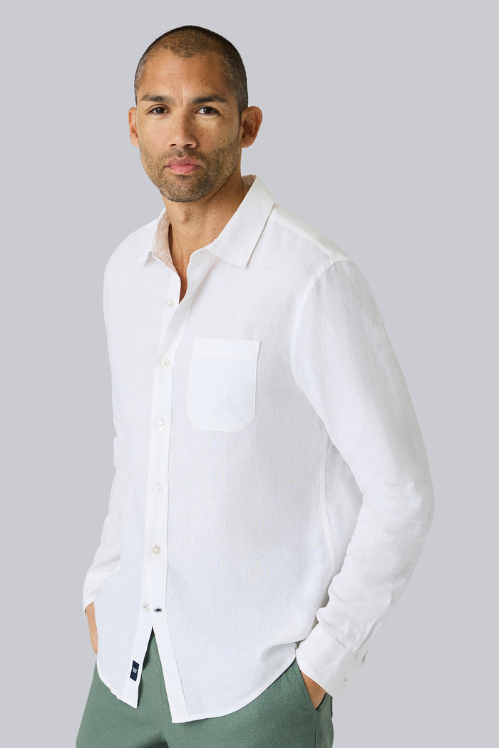 Side view of a man wearing Linen Button Up in Bright White