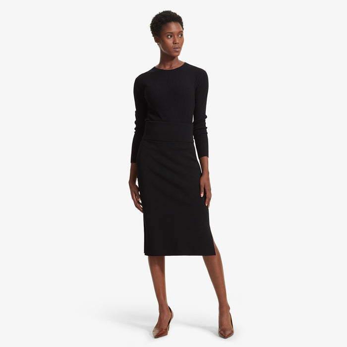 Front image of a woman standing wearing the Loraine top in Black | Lead