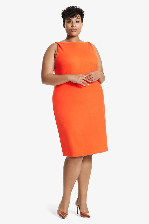 Front image of a woman standing wearing the Lydia dress textured ponte in Tangerine | Plus | Exclude | Grid