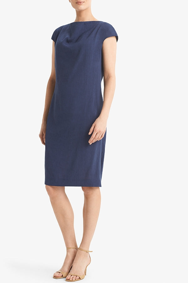 Side image of a woman standing wearing the Marilyn dress stretch linen in blueberry | Grid Hover | Exclude