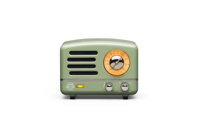 Vintage-style green radio with a yellow dial on a white background