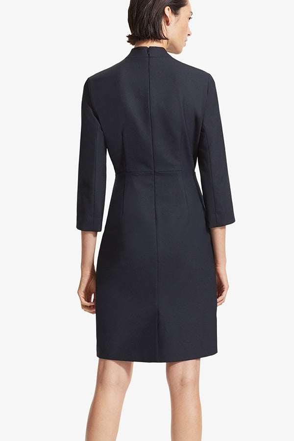Back image of a woman standing wearing the Niko dress sharkskin in Ink | Grid Hover | Exclude