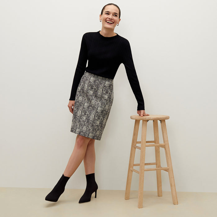 Detail image of a woman standing wearing the Noho skirt in crackle