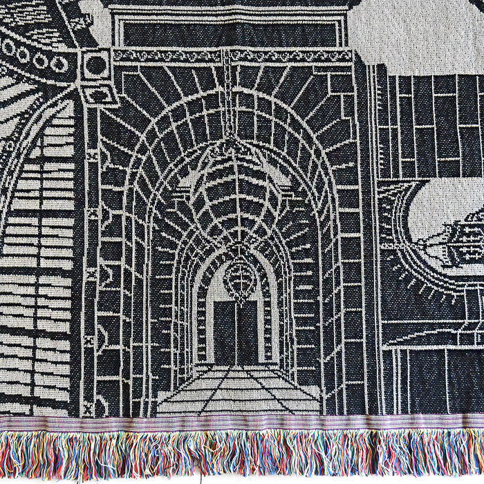 Textile with architectural design and colorful fringe at the bottom