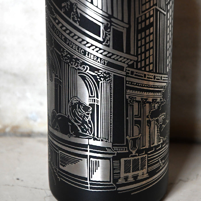 Black tumbler with detailed engravings of NYPL's lion and architectural elements.