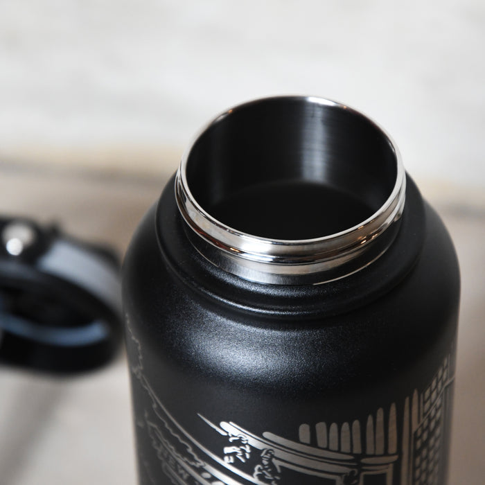 Black thermos bottle with silver rim.