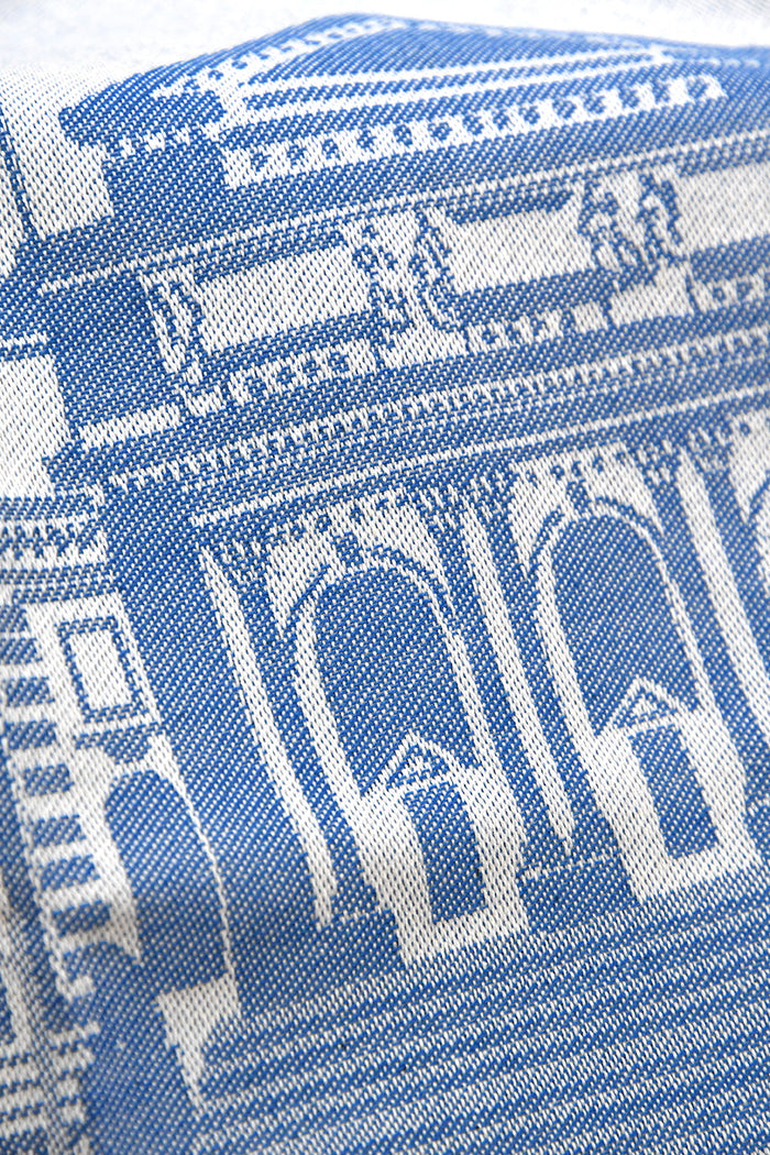 Off-blue and blue patterned fabric with architectural designs