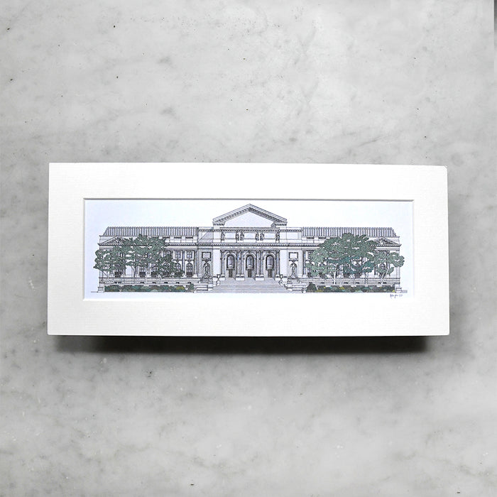 Framed black and white architectural drawing of NYPL's flagship building on a gray surface.