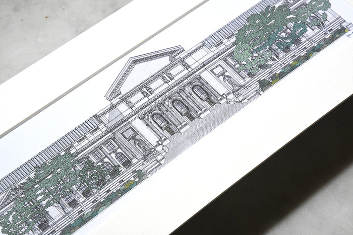Close-up of framed black and white architectural drawing of NYPL's flagship building.