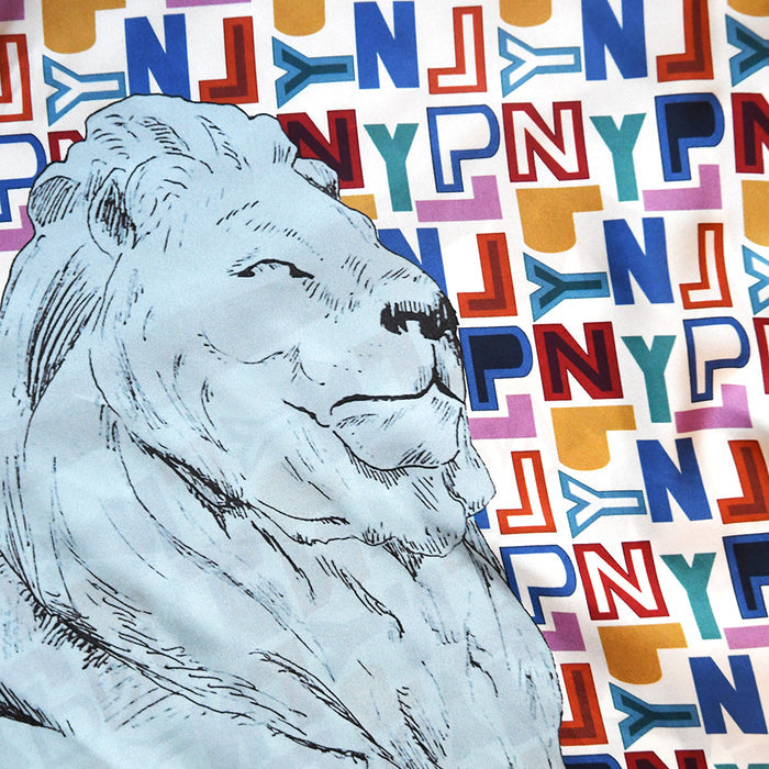 Close-up of the NYPL lion sketch on the scarf surrounded by colorful repetitive pattern of the letters NYPL.