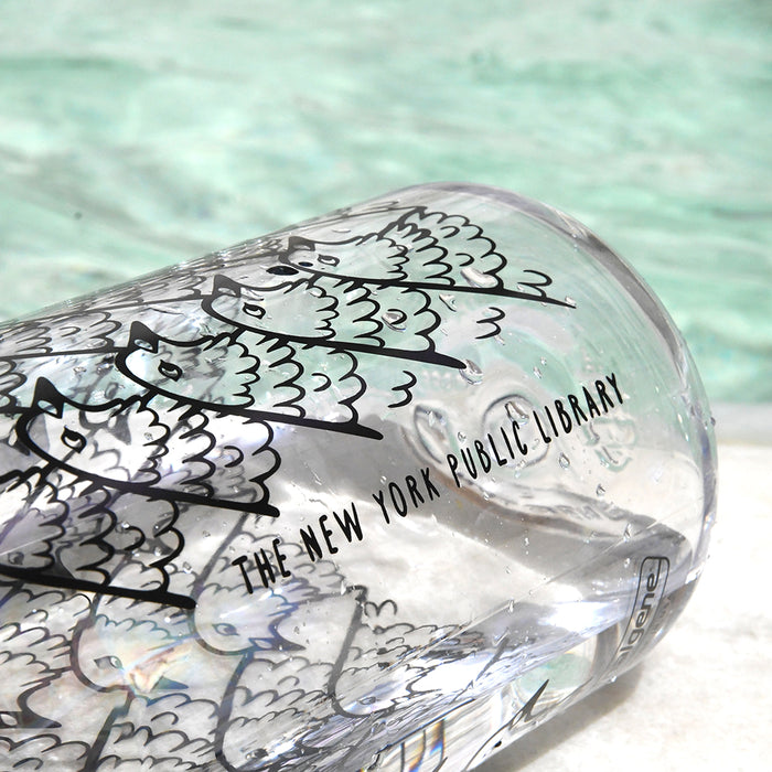 Close up of the pigeon pattern and  'The New York Public Library' text on the other side of the bottle.