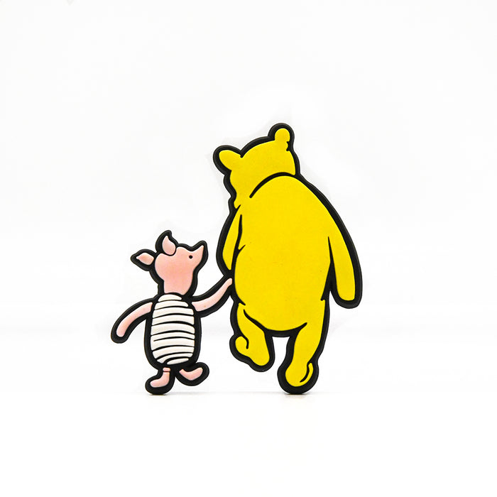 A rubber magnet shaped as Winnie-the-Pooh and Piglet from the Hundred Acre Wood.