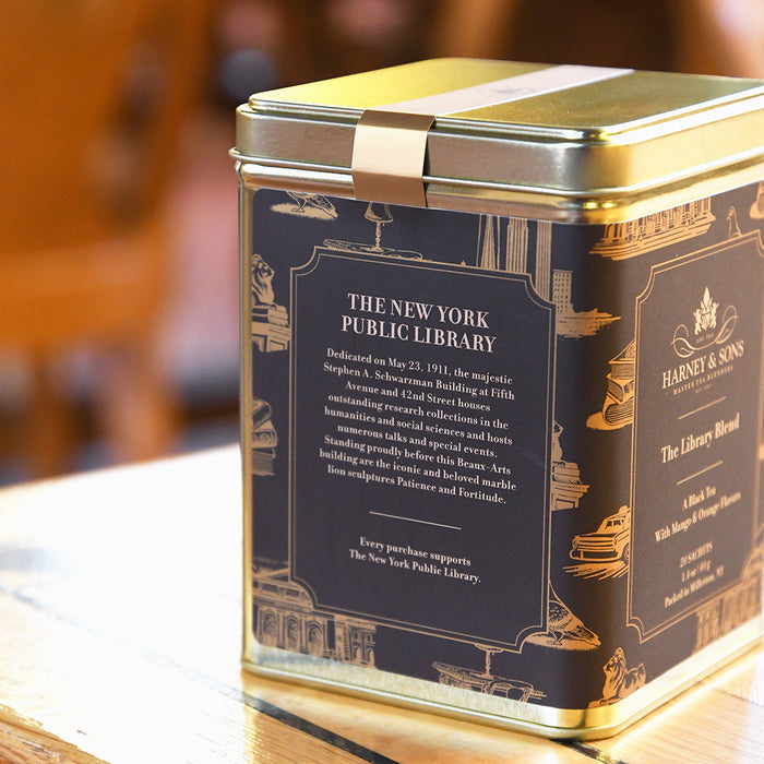 Tea canister with New York Public Library branding on a wooden surface