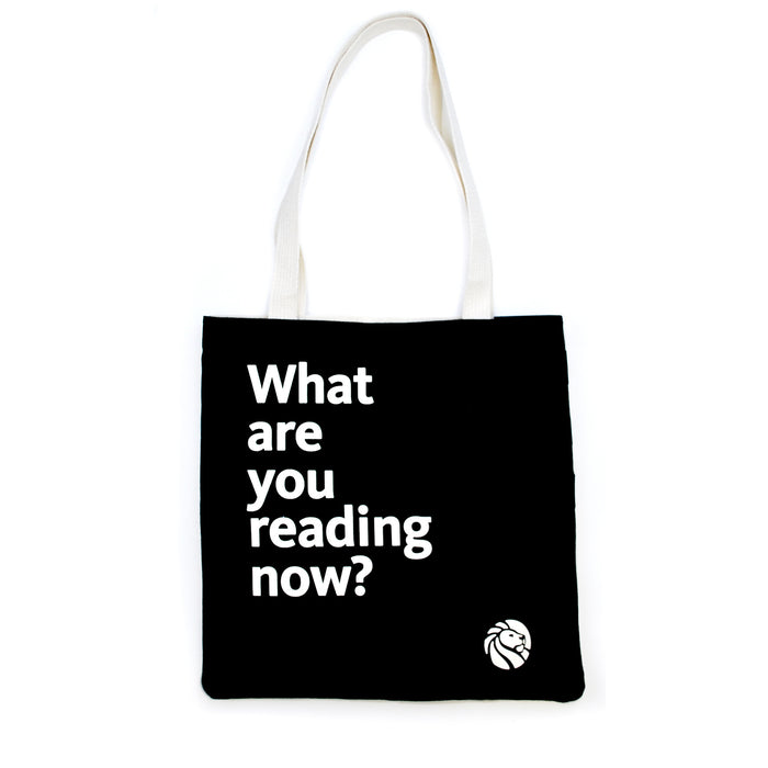 A black cotton tote bag with off-white handles featuring  the quote 'What are you reading now?'.