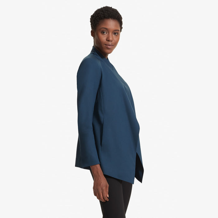 Side image of a woman standing wearing the Oliver jacket in Twilight