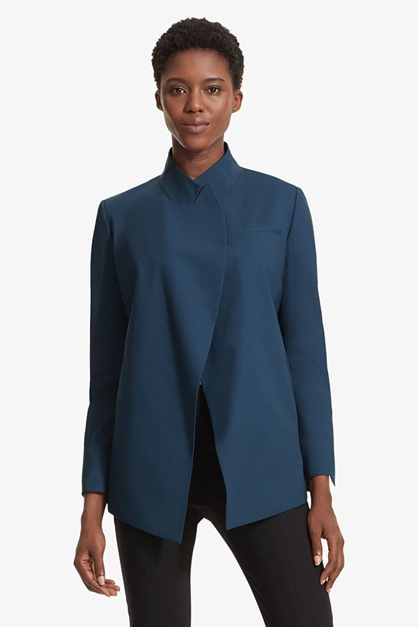 Front image of a woman standing wearing the Oliver jacket in Twilight | Grid | Exclude
