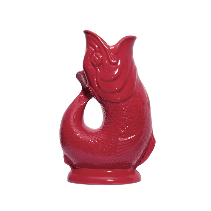 Cranberry red ceramic fish-shaped vase on a white background