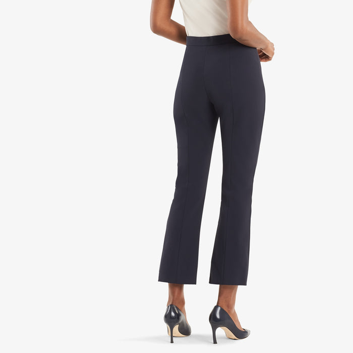 Back image of woman wearing the Oshima pant in dark navy.