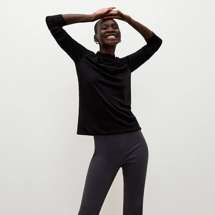 Front image of a woman standing wearing the Oshima pant in Monsoon  | Lead