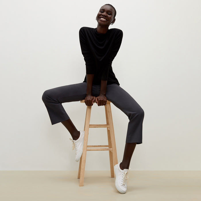 Side image of a woman standing wearing the Oshima pant in Monsoon