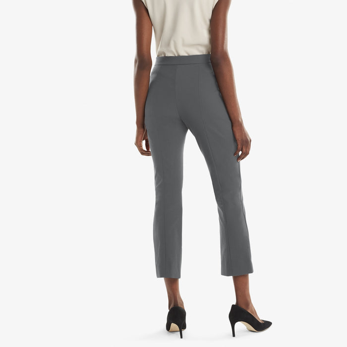 Back image of a woman standing wearing the Oshima pant in Monsoon | Exclude