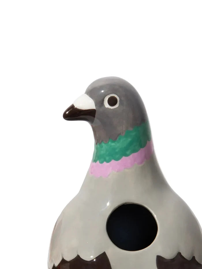Close up of a ceramic pigeon-shaped vase