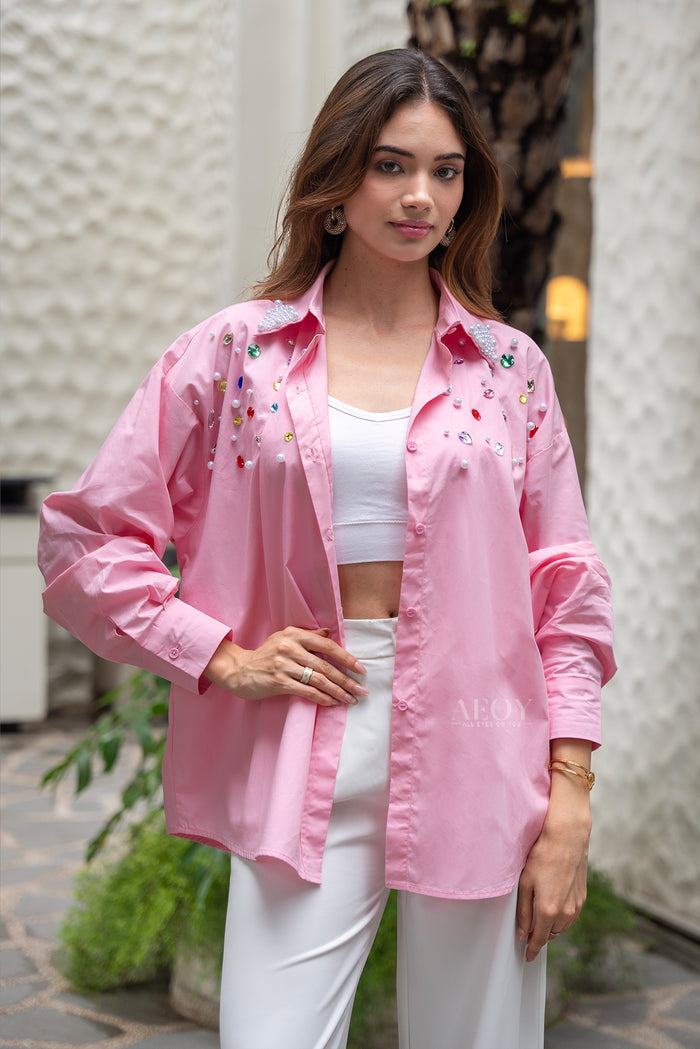 Women pink shirt with pearl details