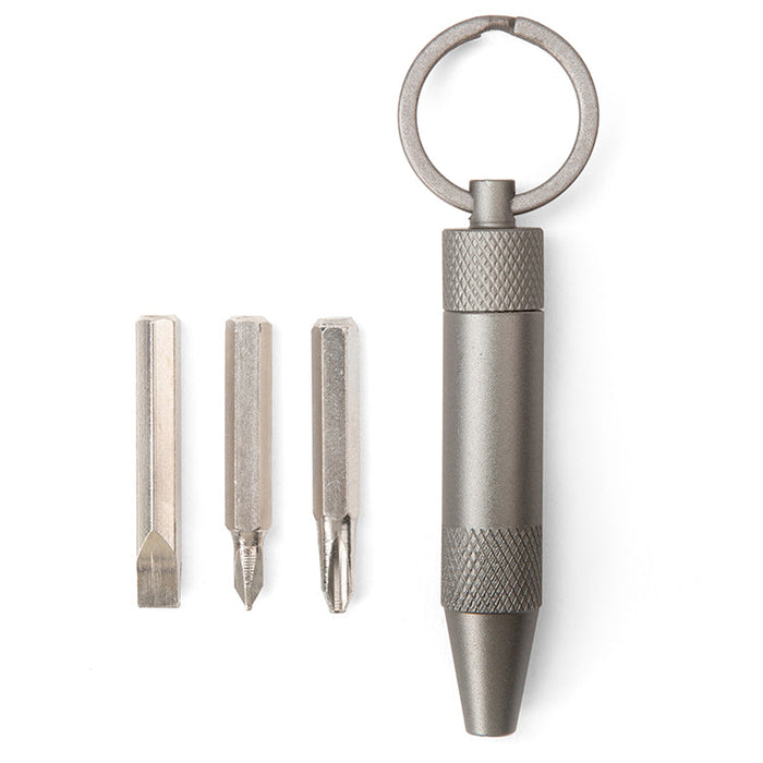 Multitool keychain with interchangeable bits on a white background