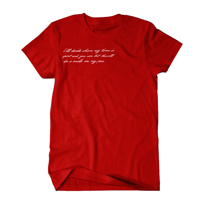 A Gorilla Biscuits red T-shirt with white cursive text on the chest—Ill decide where my time is spent and you can bet therell be a smile on my face—lays flat on a white background, celebrating personal choices and happiness.