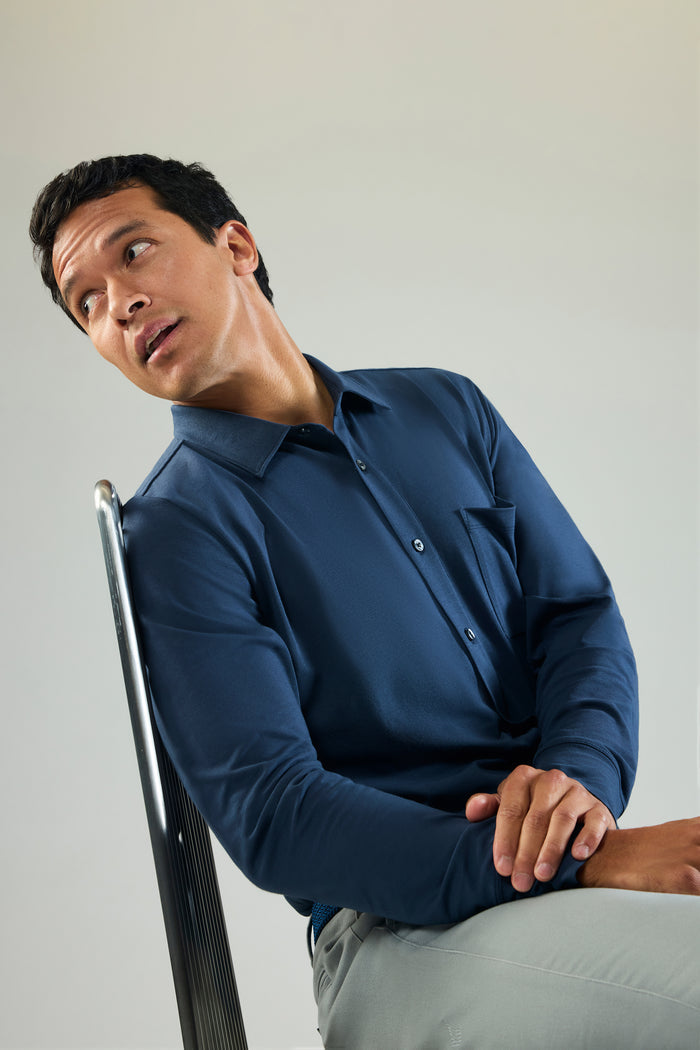 Man sitting and wearing Silver Jersey Button Up in True Navy