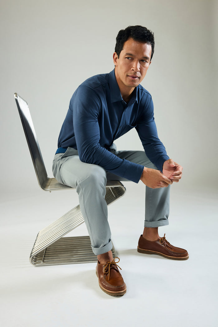 Man sitting and wearing Silver Jersey Button Up in True Navy