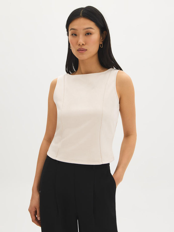 Sleeveless faux suede shell top with boat neckline by Suzy.