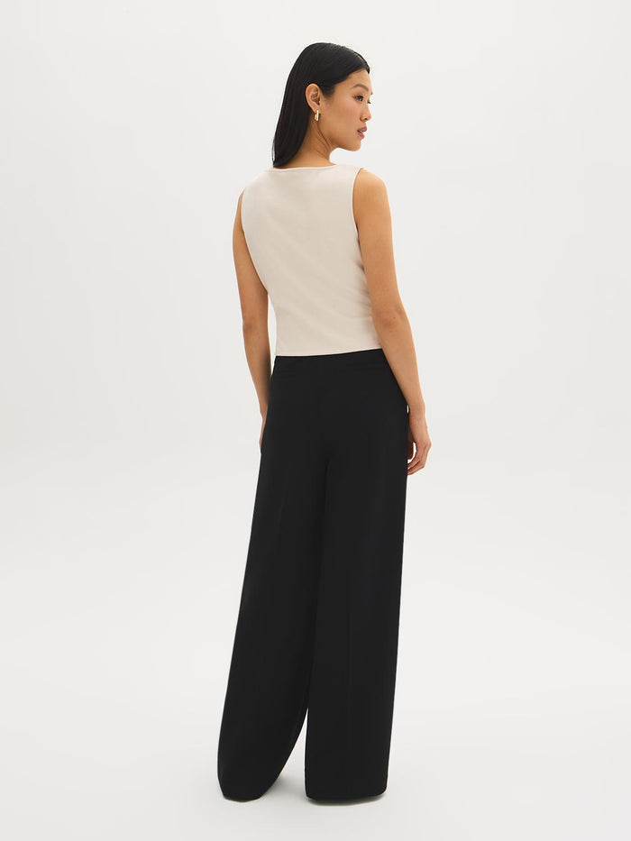 Sleeveless faux suede shell top with boat neckline by Suzy.