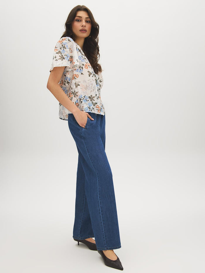 Winter White Floral Print Blouse with Smocked Shoulders - Woman Wearing Button-Front Top - Suzy Shier