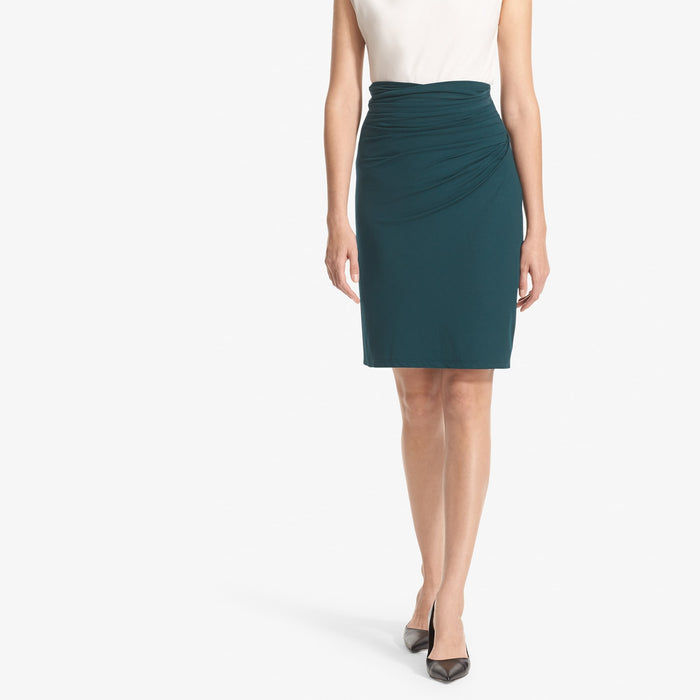 Front image of a woman standing wearing the Soho Skirt in Rainforest | Lead