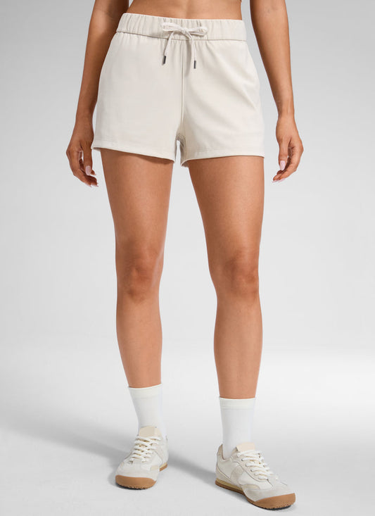 CRZ YOGA Women's Travel Stretch Mid-Rise Drawstring Shorts 2.5" Milky White