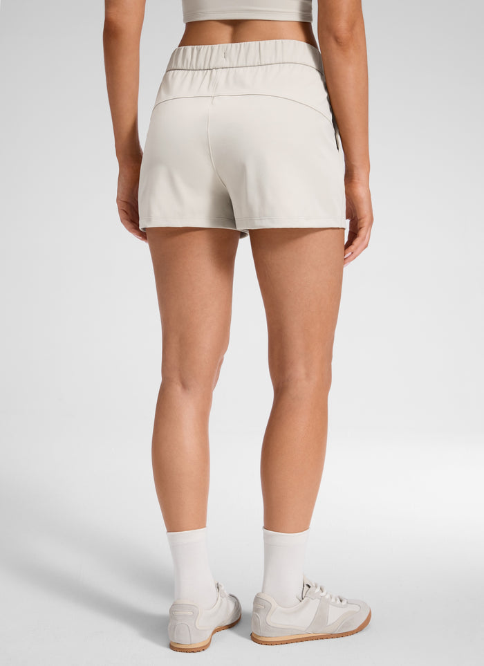 CRZ YOGA Women's Travel Stretch Mid-Rise Drawstring Shorts 2.5" Milky White