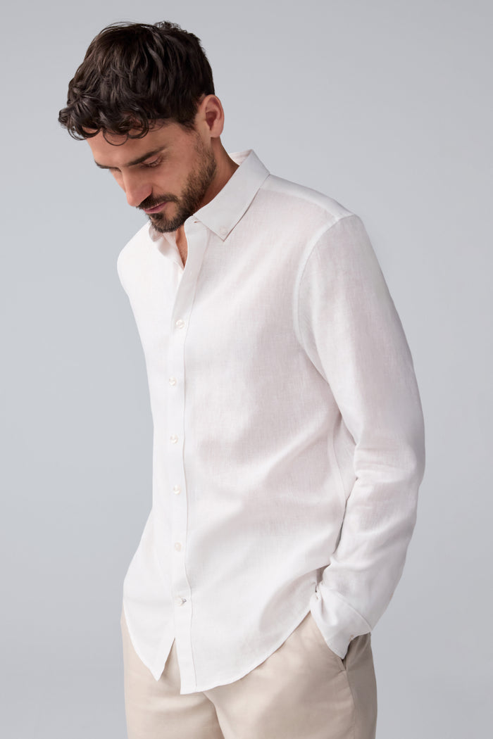 Side view of a man wearing Tech Linen Button Up in Bright White